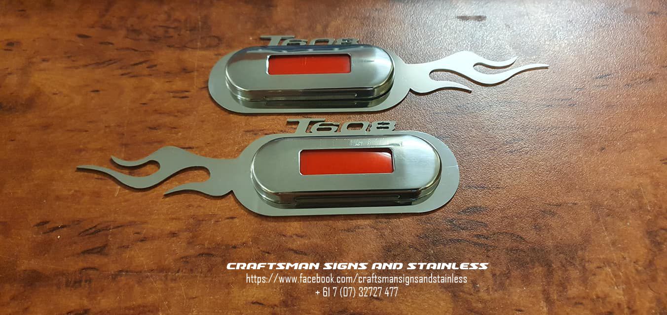 Stainless Steel courtesy light surrounds for a Kenworth K200