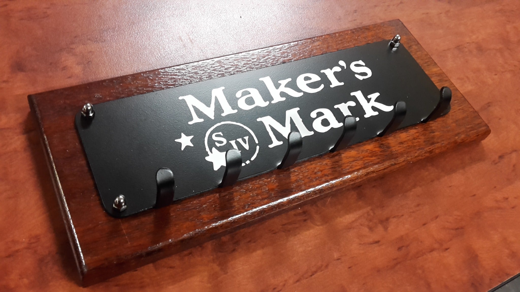 Wall mounted key ring/medal holder Maker's Msrk