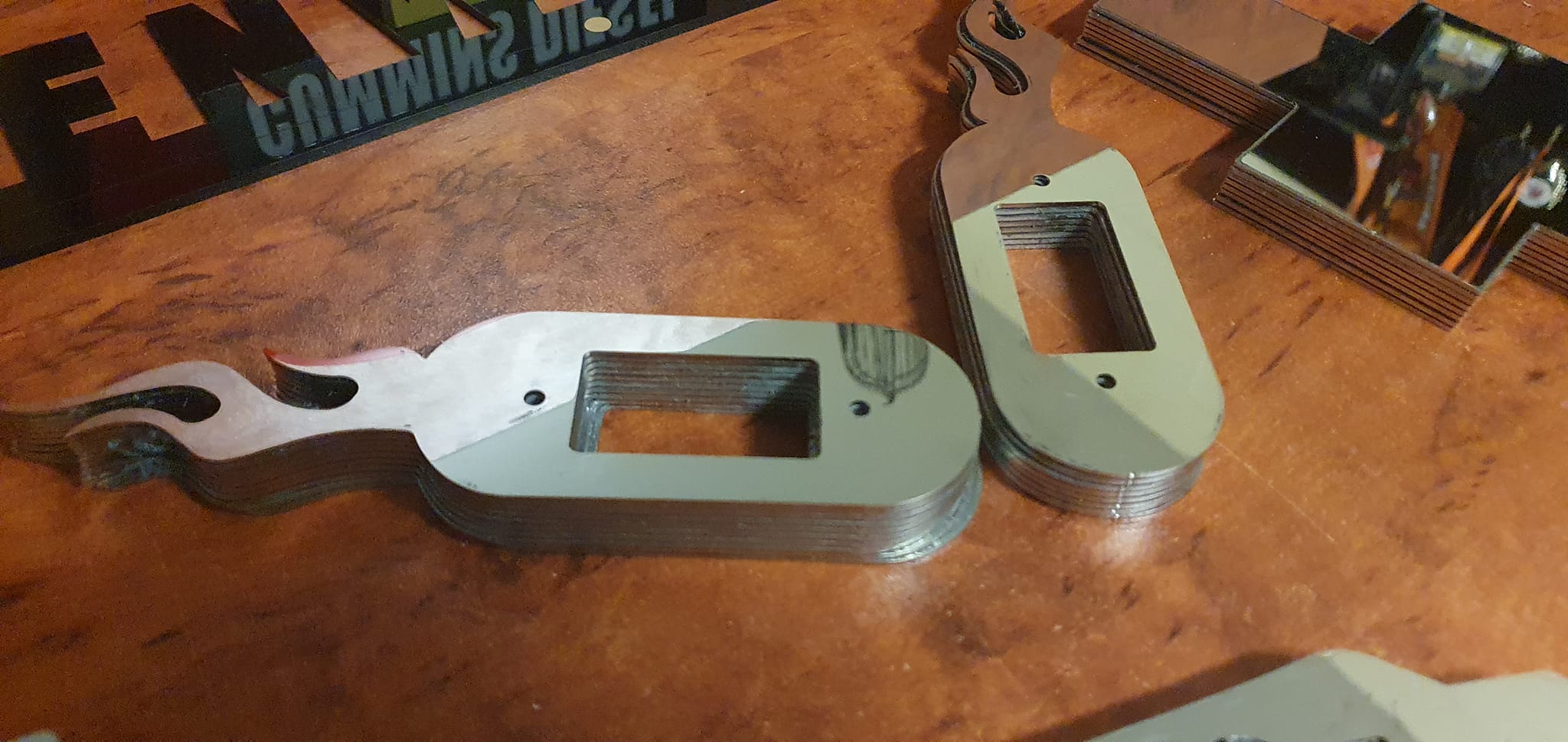 Stainless Steel courtesy light surrounds for a Kenworth (Flames)