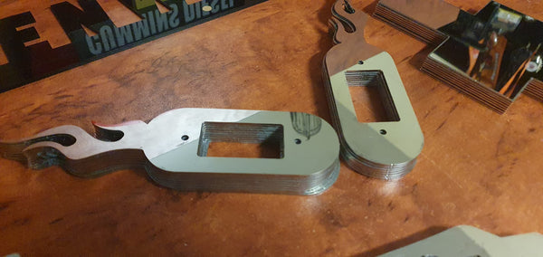 Stainless Steel courtesy light surrounds for a Kenworth (Flames)