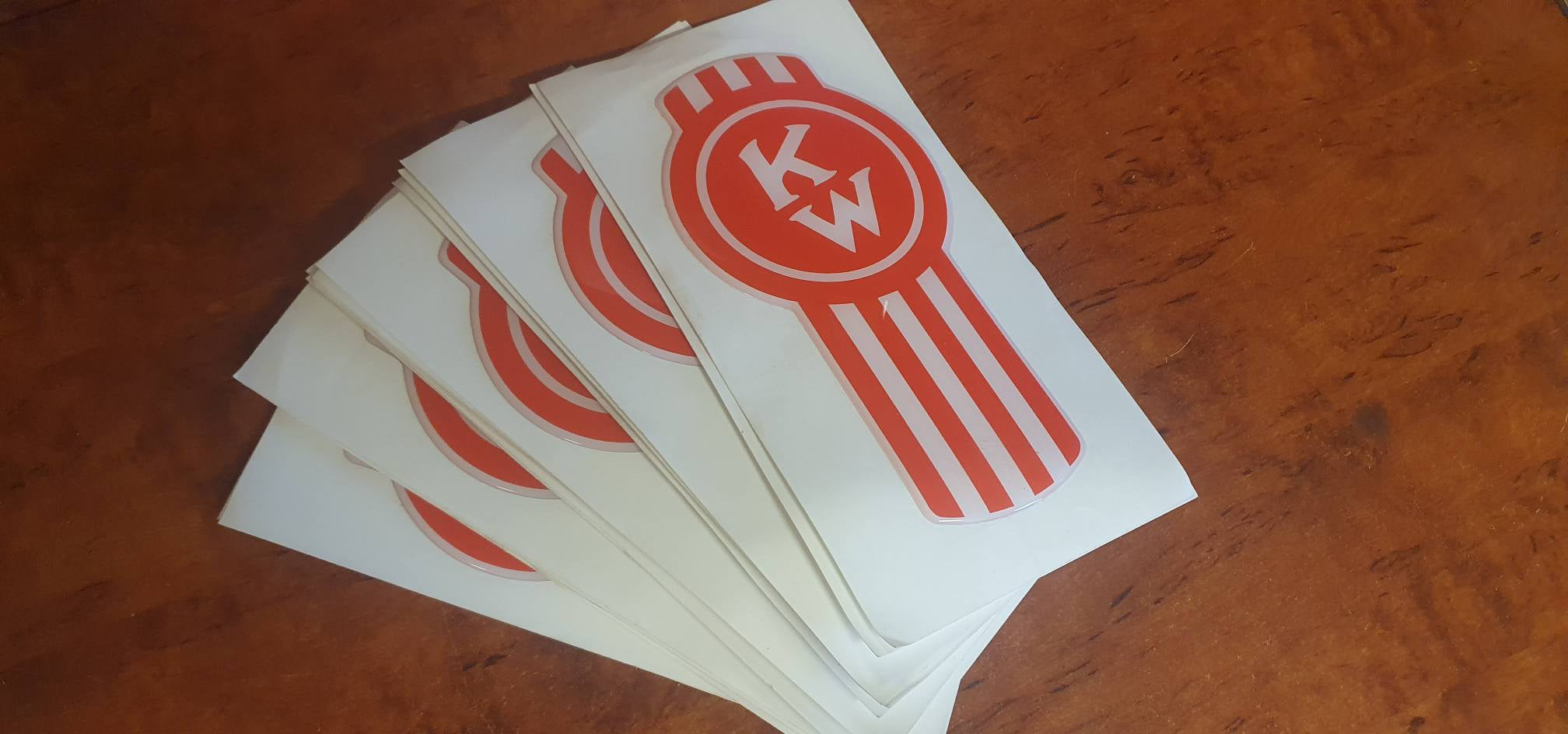 Red/white epoxy domed Kenworth 'Crooked' bug logo vinyl skins