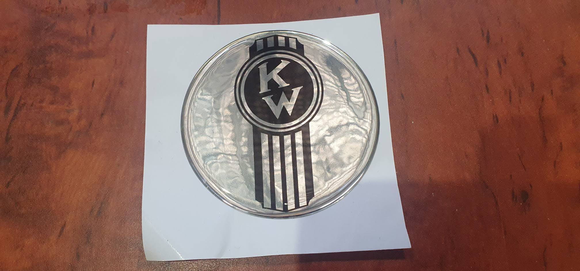 KENWORTH crooked KW round epoxy domed vinyl skin on chrome 'metal'