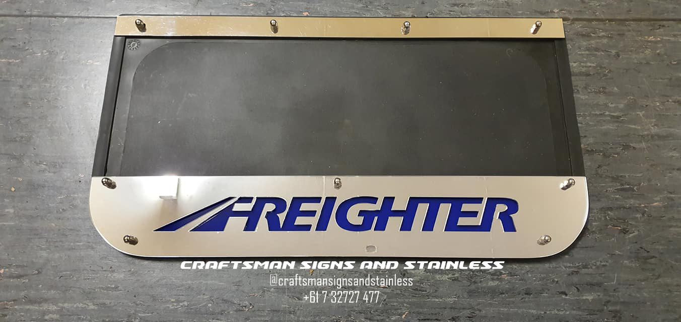 Stainless steel mudflap counterweights with 'FREIGHTER'cut outs