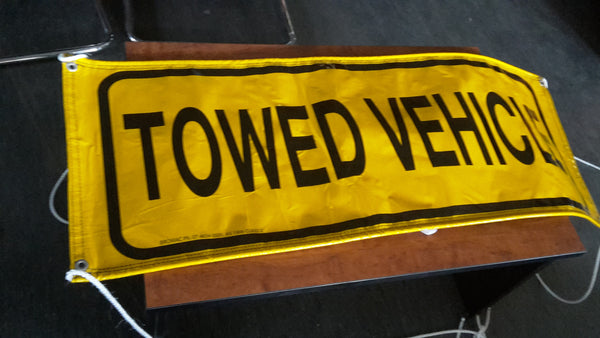 Sign, HD vinyl TOWED VEHICLE with ties.